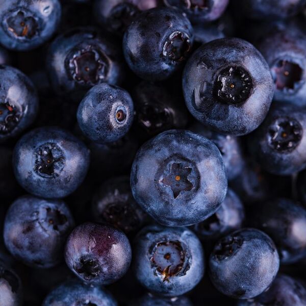 Glass of water with lemon on a bright table